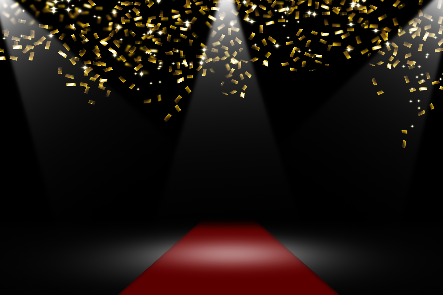 a red carpet with gold confetti falling from the ceiling